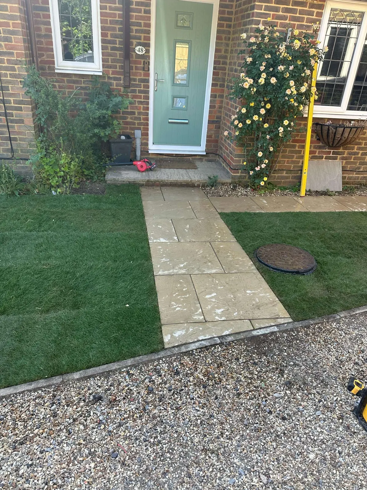 Sandstone front path through newly laid turf